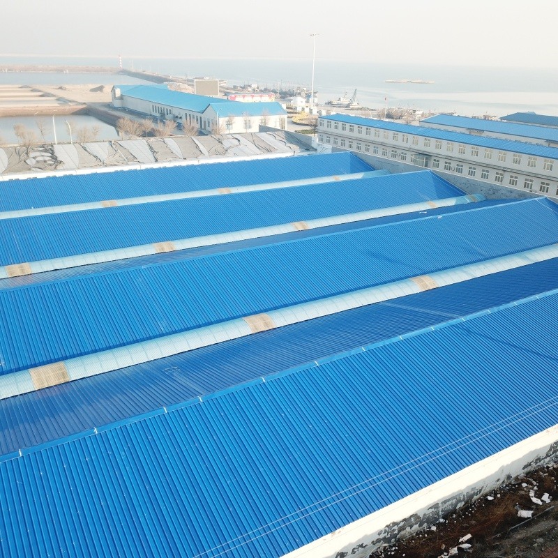 1 Industrial buildings with blue roofs near the sea