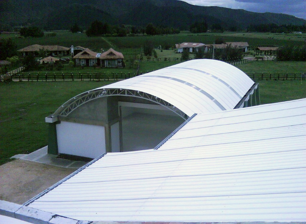 1 A large building with a curved metal roof